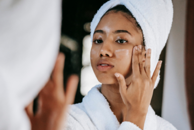 Woman applying the Ordinary Skincare product