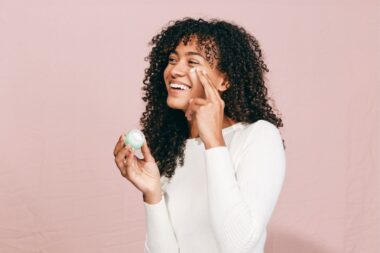 Woman applying eye creeam